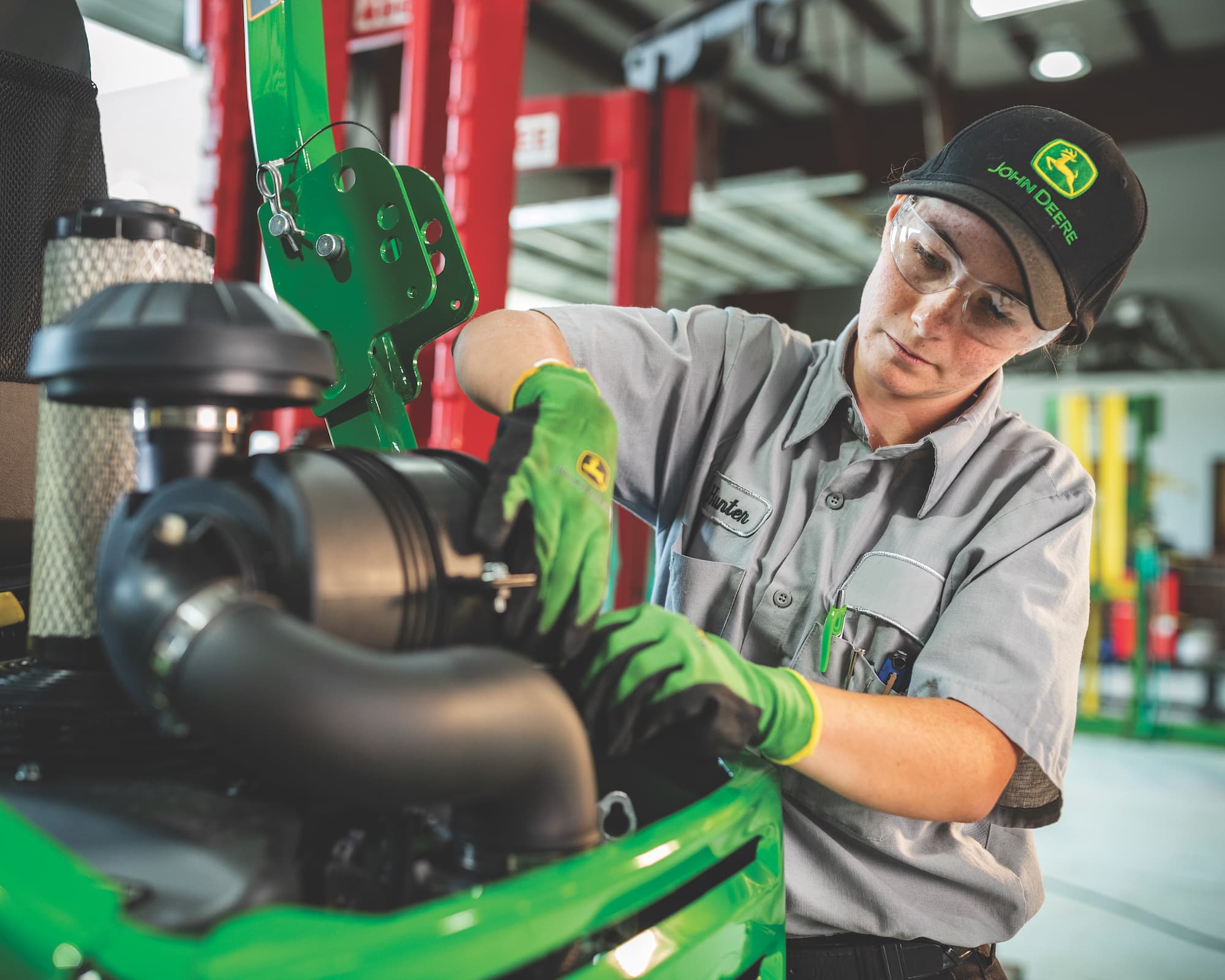 service technician working on tractor